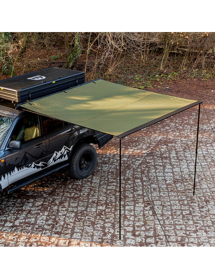 Green Wild Camp 2x2.5 m vehicle awning open next to an off-road vehicle in the woods