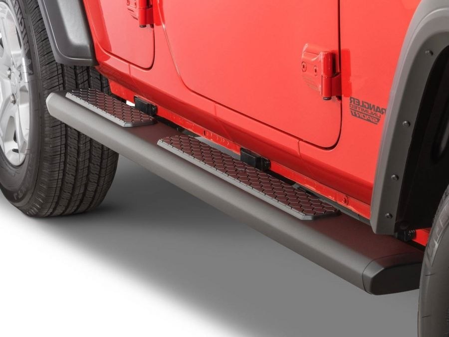 Aluminium running boards on a red Jeep Wrangler JL Unlimited